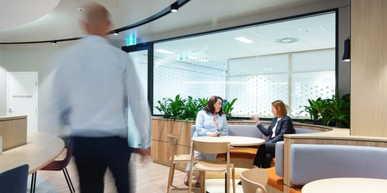 Staircase and green wall inside a modern office space