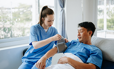 Doctors and nurse looking at an xray image in their hospital office