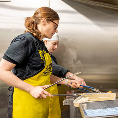 QBE Foundation local grants winners - Employee choice - OzHarvest team members cooking