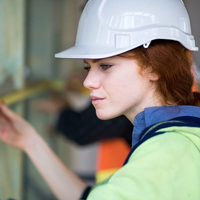 Insurance for tradies - woman in hard hat