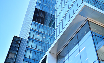 Modern office building close up in sunlight