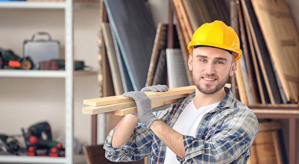 Young carpenter standing in workshop