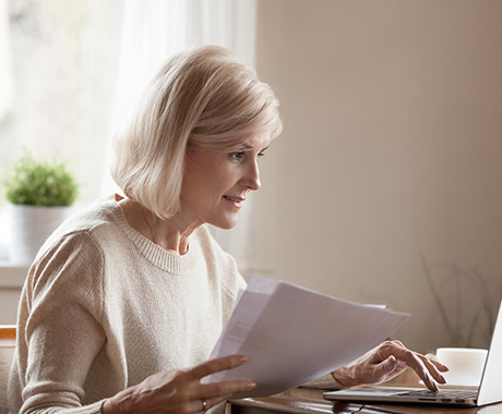 Financial hardship - Tired young mother reviewing her budget