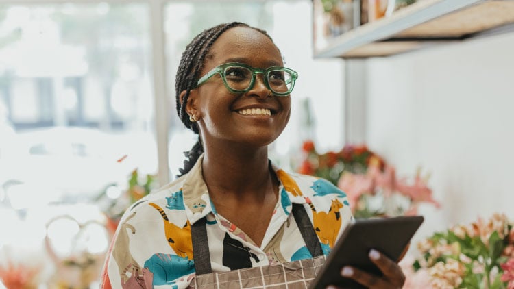 Female florist using a tablet