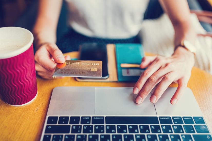 Women using laptop with credit card