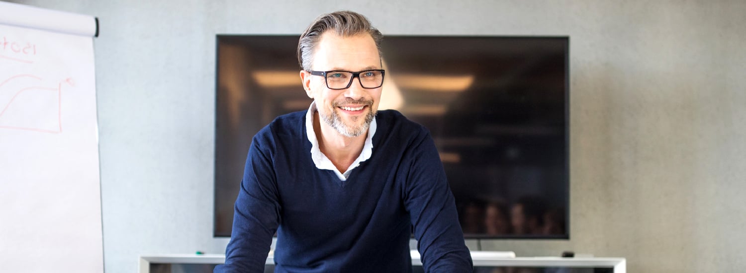 Professional middle-aged man smiling.