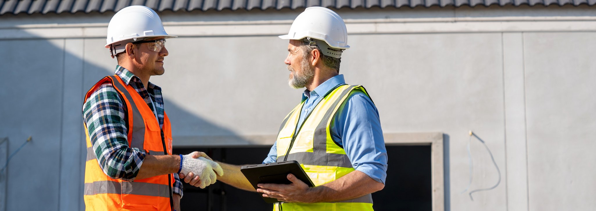 Two tradesmen shaking hands