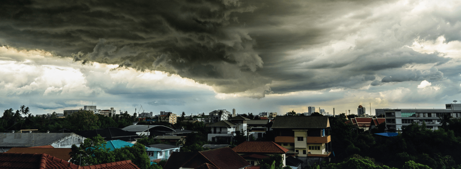 Storm clouds over residential homes