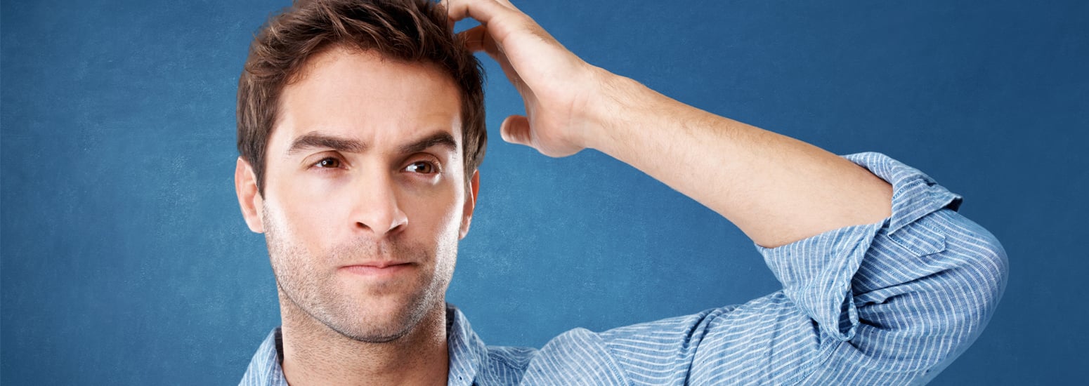 Man scratching his head