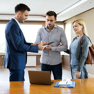 Real estate agent and young couple