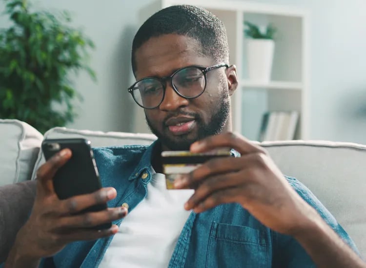 Man paying his insurance premium by credit card over the phone
