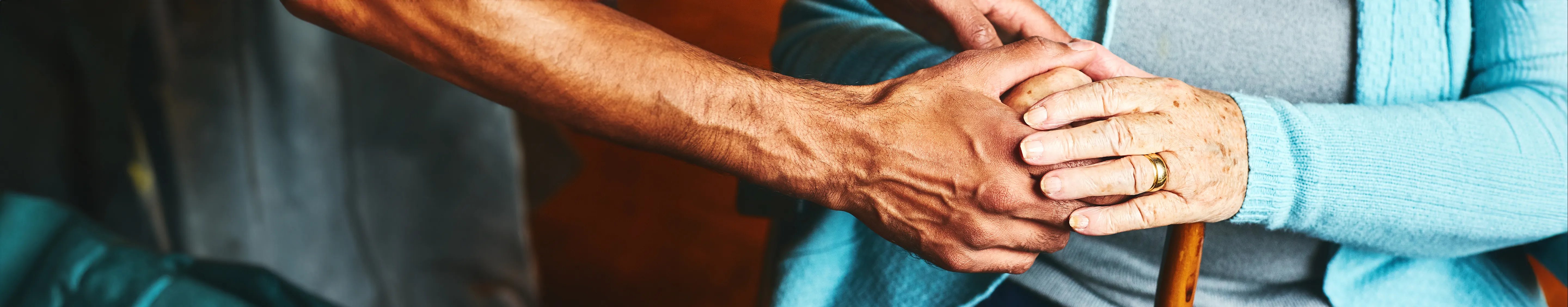 Two people holding hands together