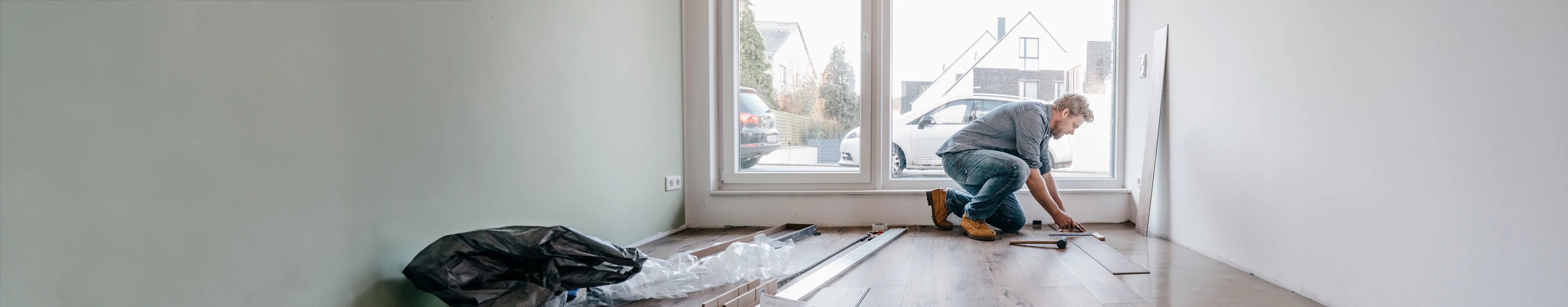 Restorer working on a wooden floor