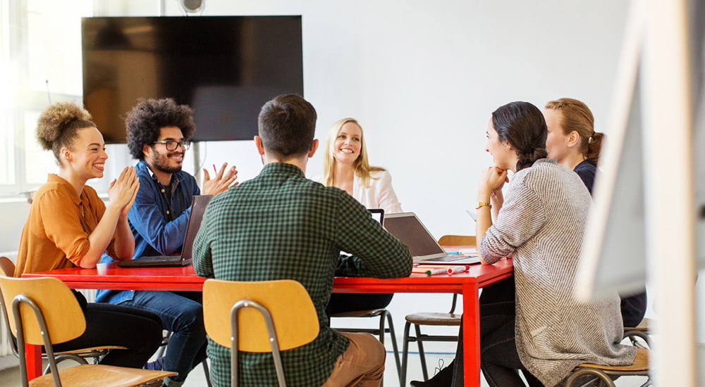Experienced underwriters discussing real-word scenarios.