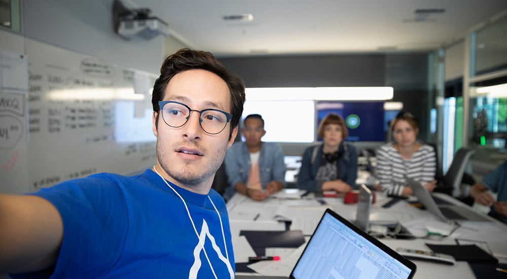 Selfie photo of a team working at a messy desk on a microsimulation
