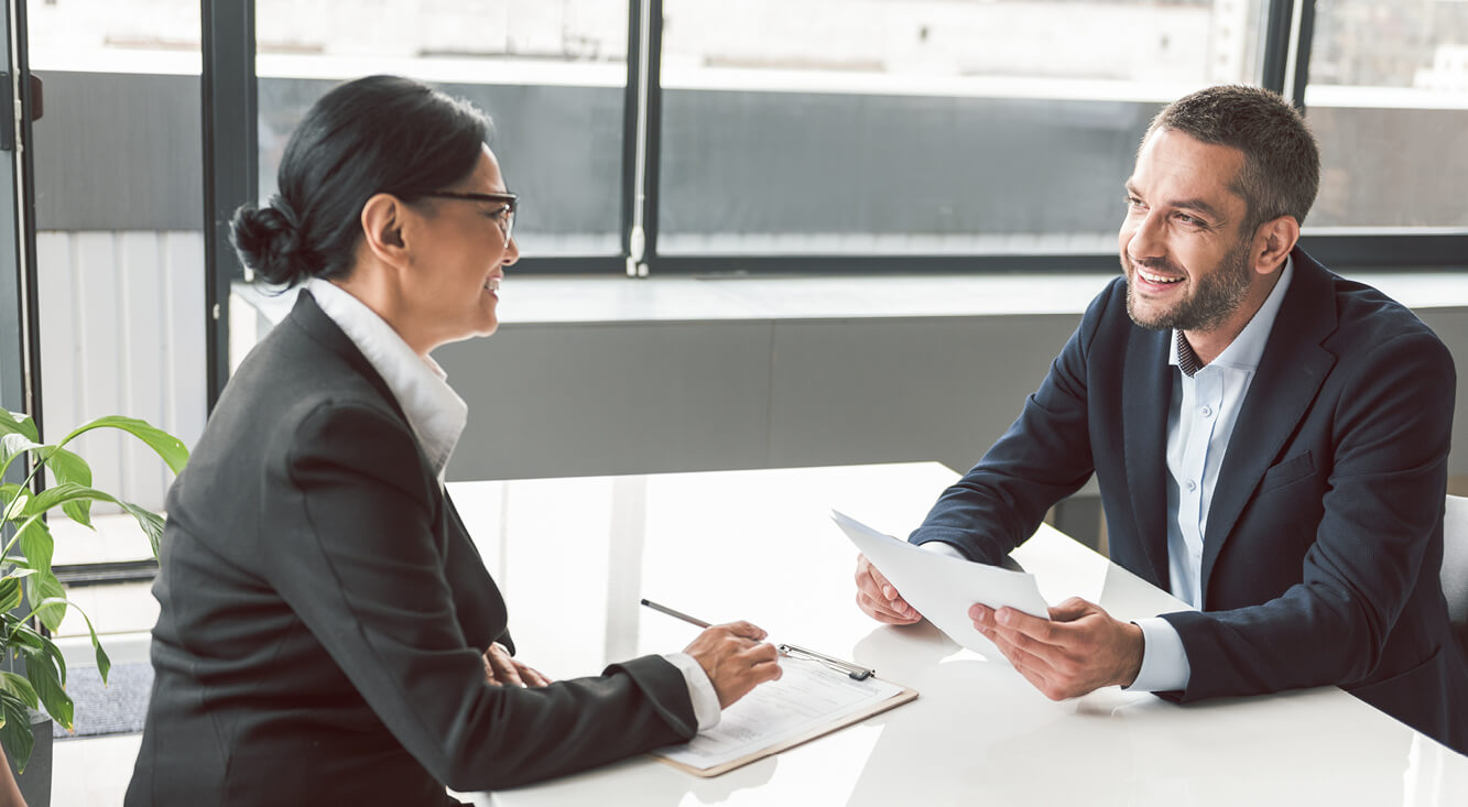Coaching and advise, two business colleagues working together.