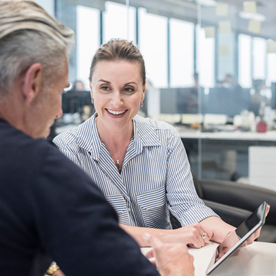 Female broker discussing sum insured with her customer