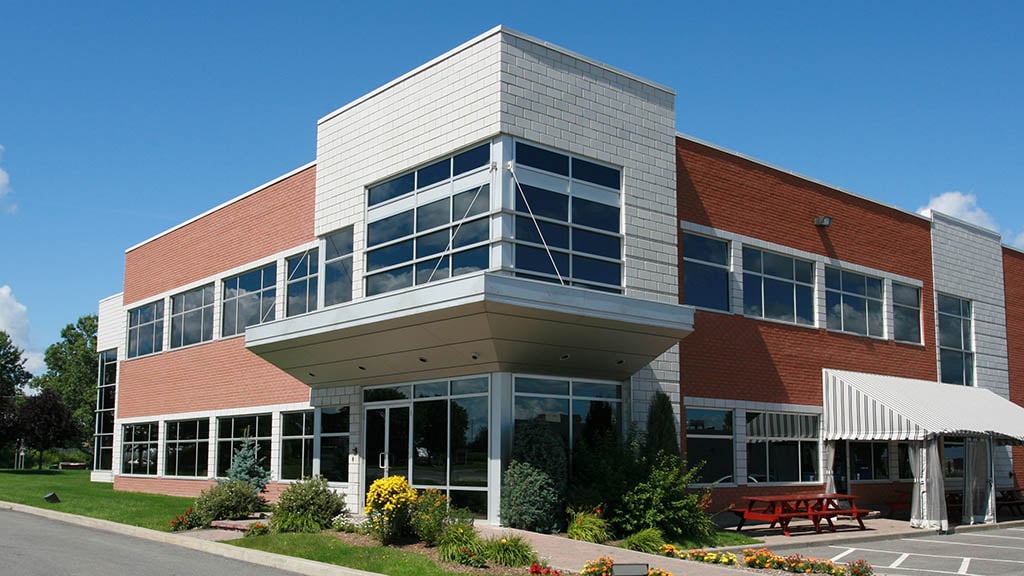 A two-storey commercial office building, representing business property insurance