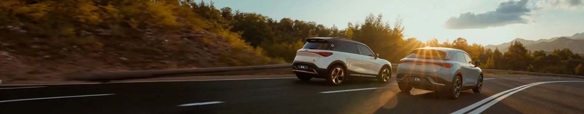 Two cars driving side by side
