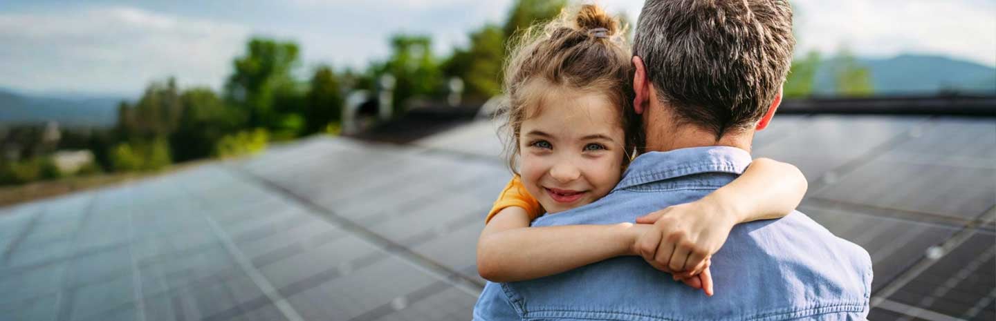 A young girl in her father's arms