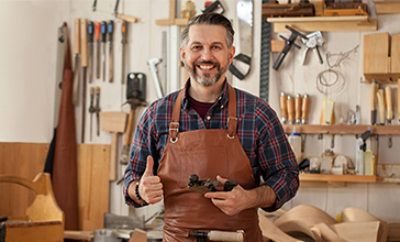 Young carpenter standing in workshop