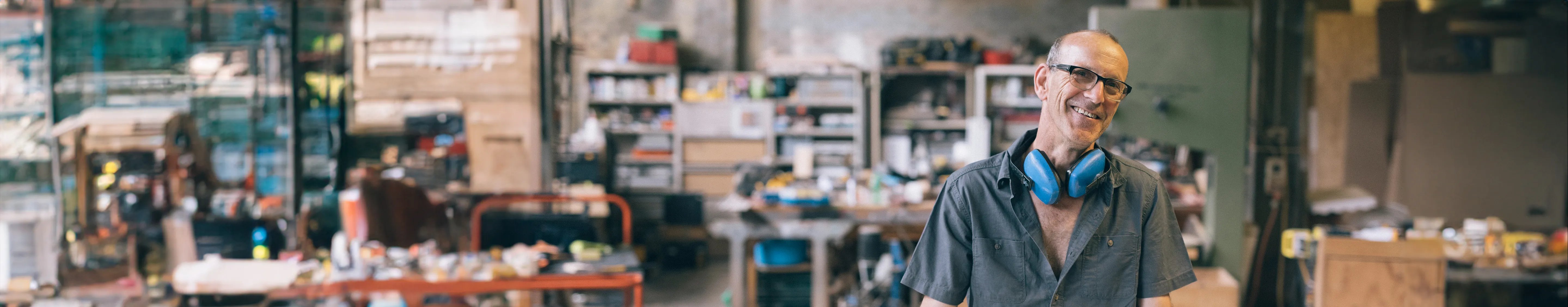Claims innovation - man standing in his workshop