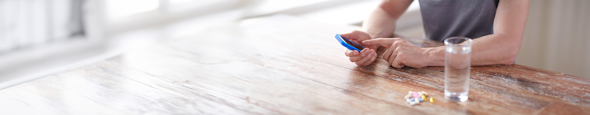Person checking the details of their medication on their smartphone