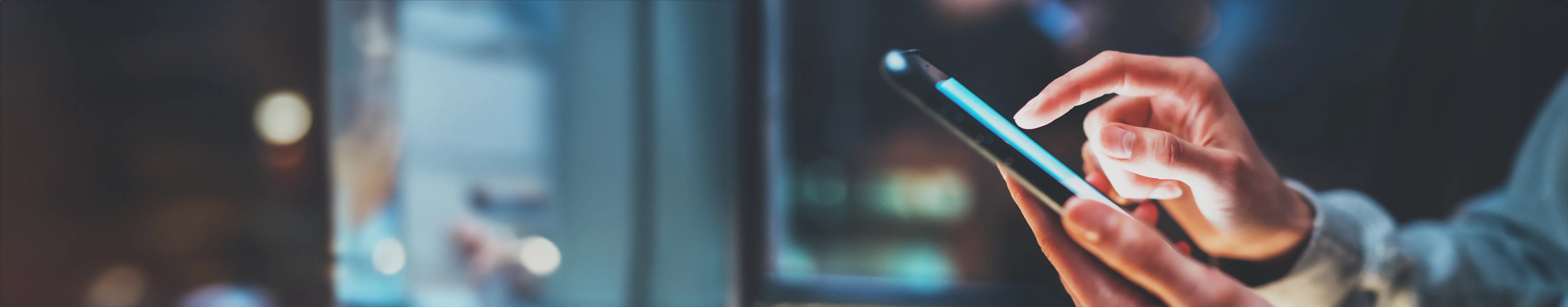 Close up of woman's hands using mobile phone