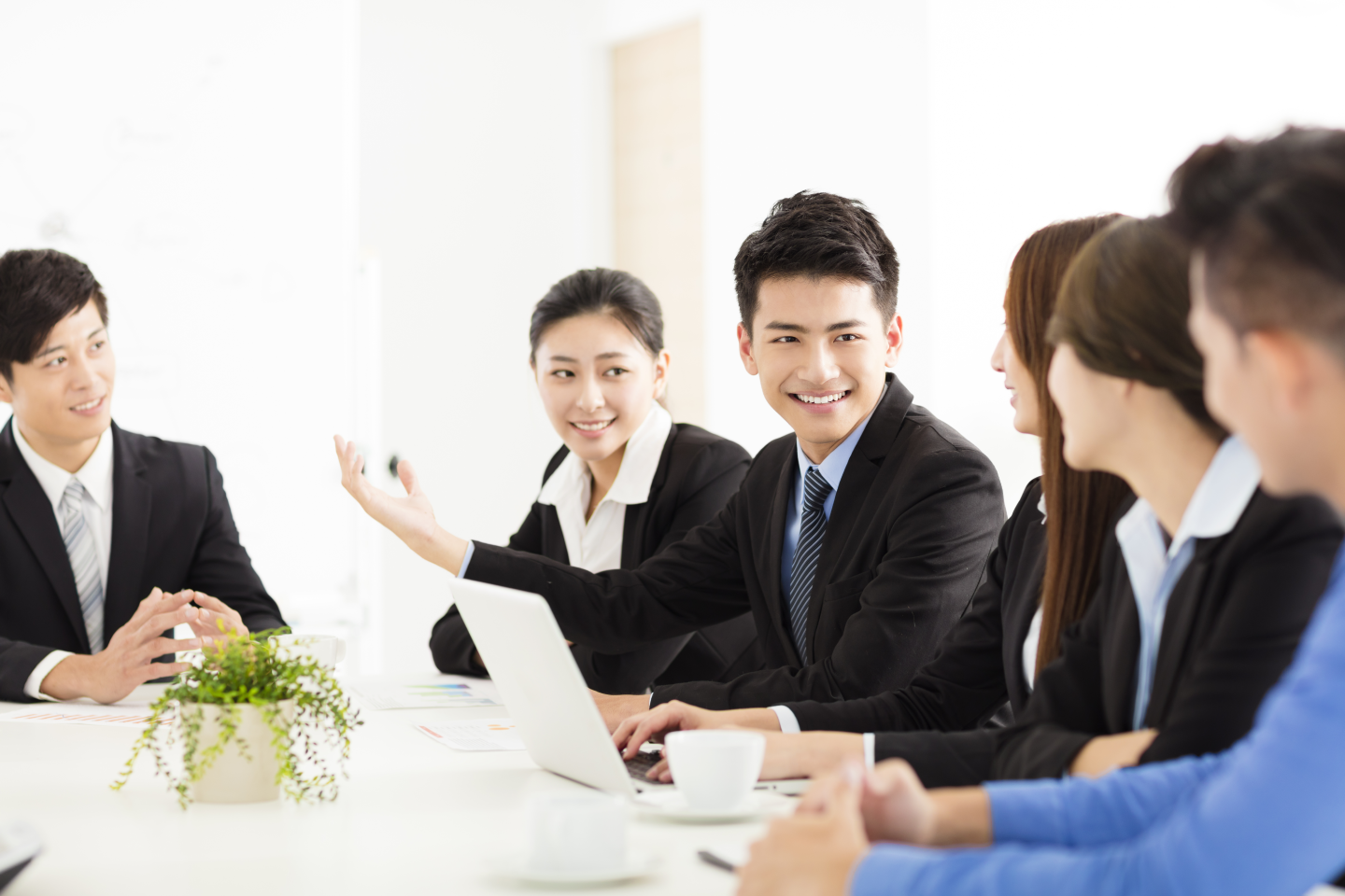 a group of people in a meeting