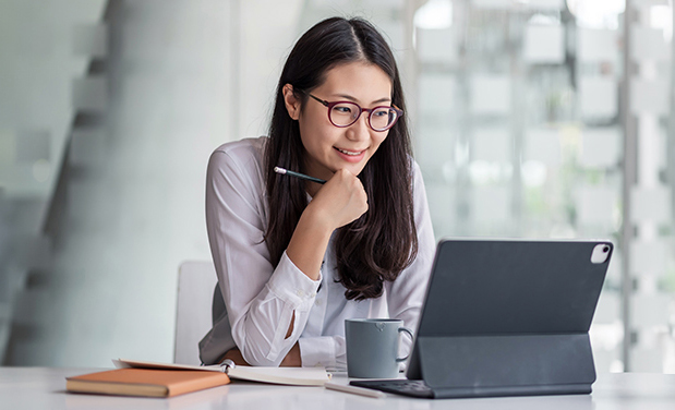 Woman looking at laptop