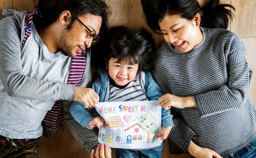 Family holding sign