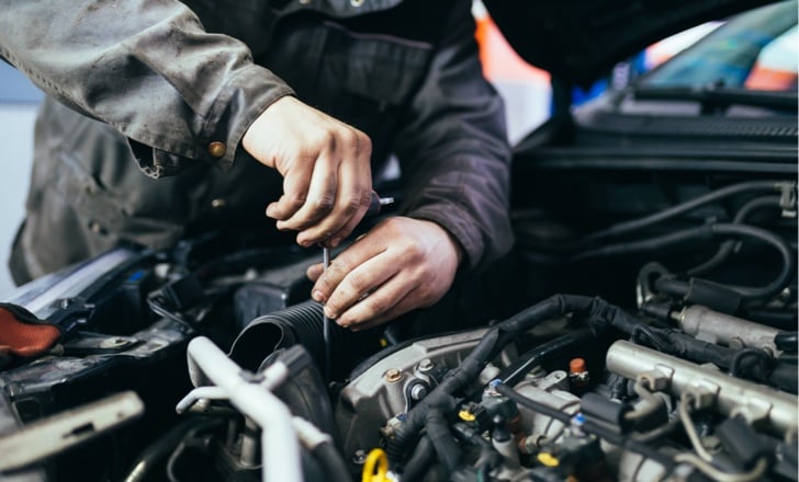 man working on a vehicle