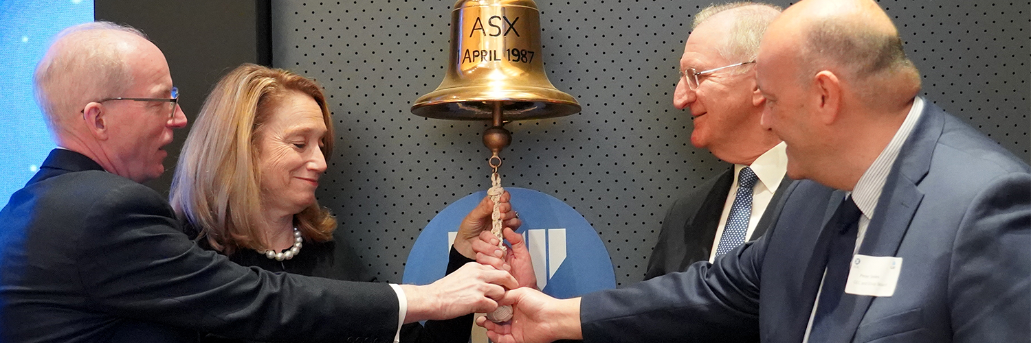 QBE board members ringing a bell