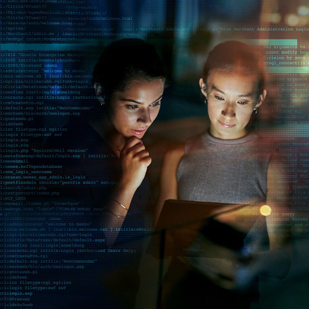 two women looking at a computer