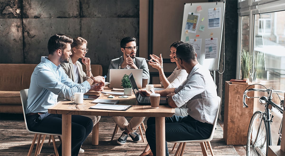 colleagues sitting around a table