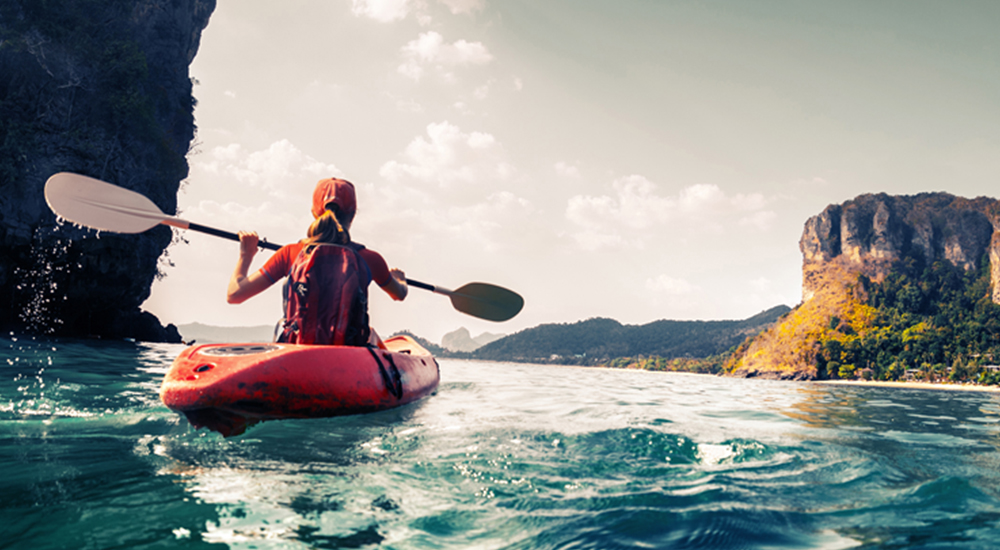 lady on a canoe in water